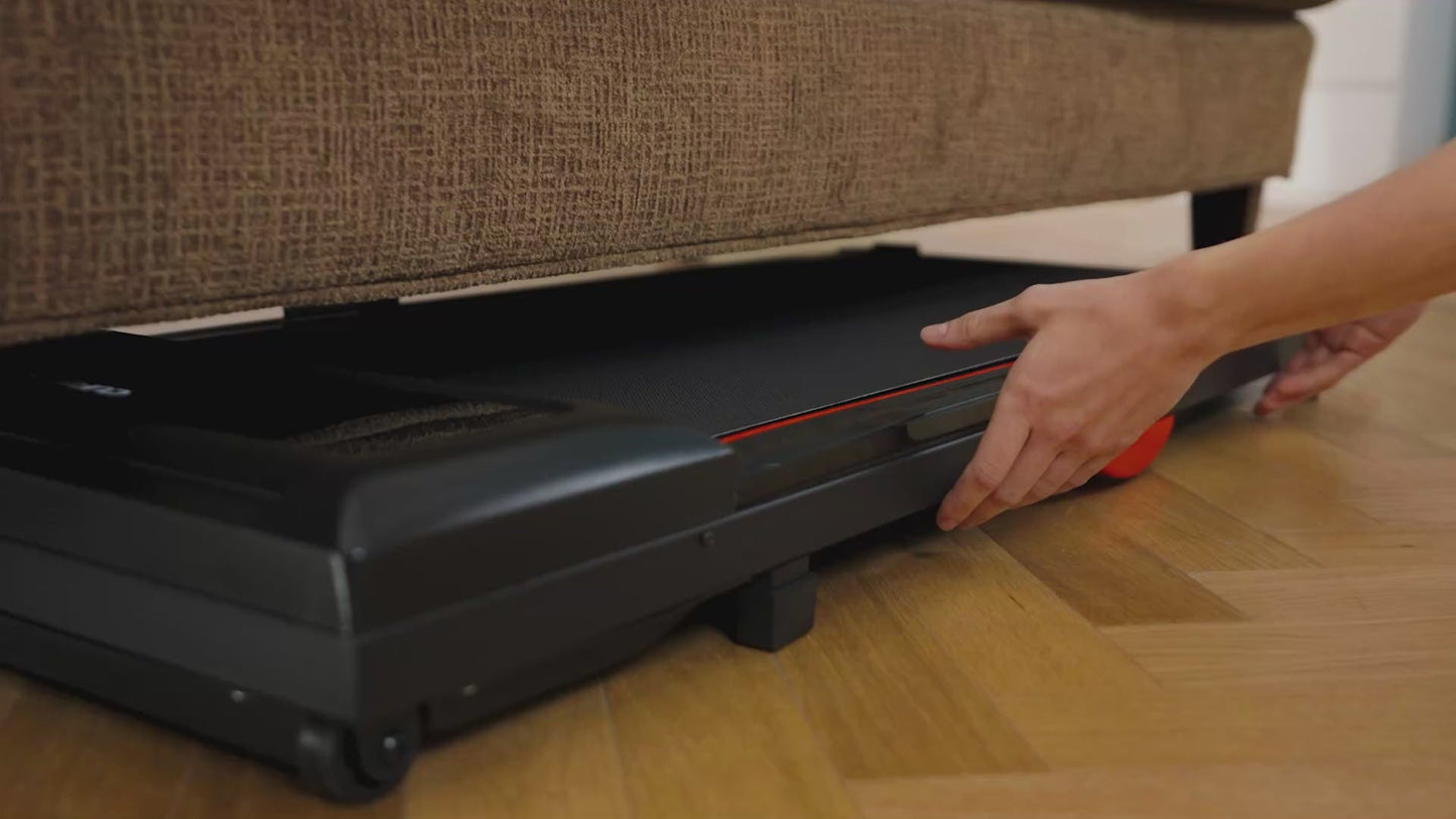 Person opening a black storage compartment under a brown sofa.