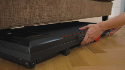 Person opening a black storage compartment under a brown sofa.
