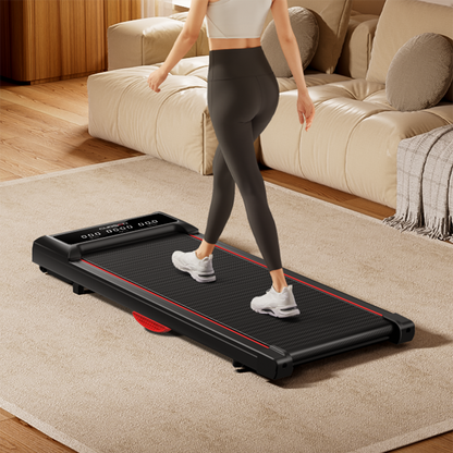 Person using a portable treadmill in a living room setting