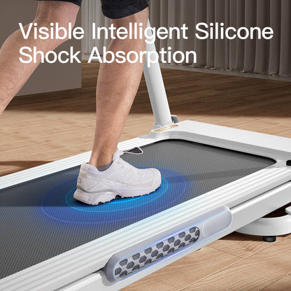 Person using a treadmill with visible intelligent silicone shock absorption feature.
