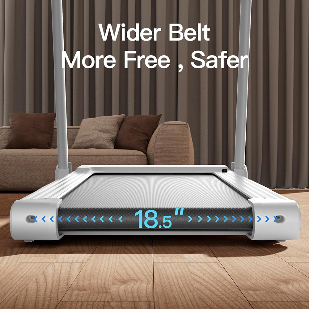 Treadmill with a wider belt in a room with a couch and curtains.